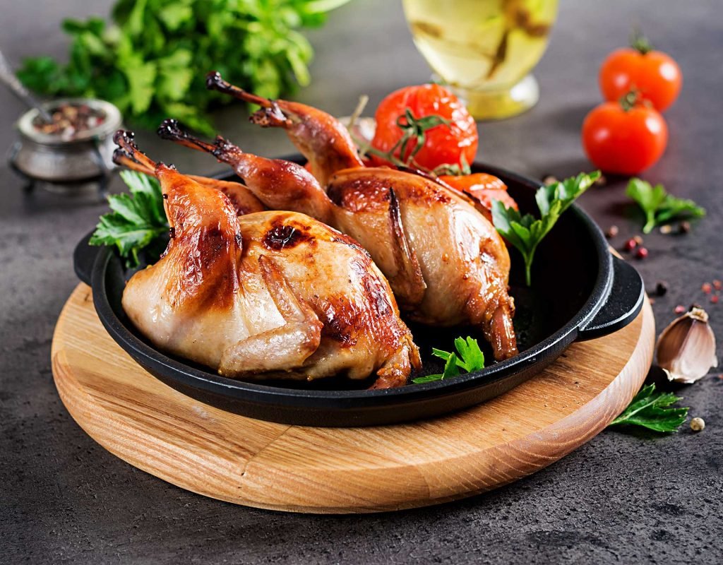 Summer drink with raspberries, lime and ice cube