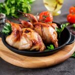 Summer drink with raspberries, lime and ice cube