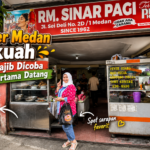 Semangkuk soto Medan dengan kuah santan kuning dan taburan bawang goreng